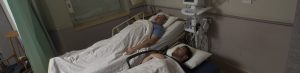 two men in hospital beds