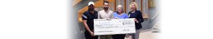 Lago family presenting proceeds from golf tournament