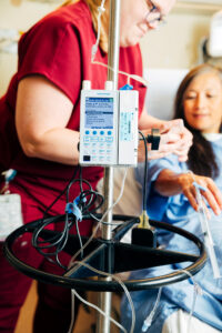 Nurse and patient and IV Pump