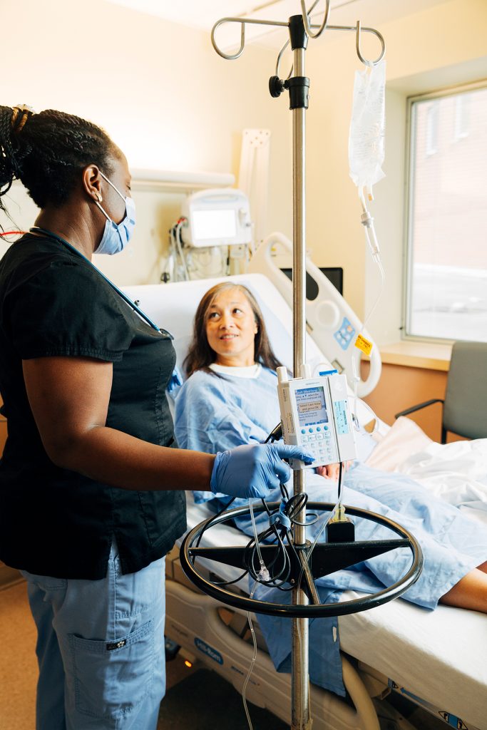Nurse and patient with IV Pump